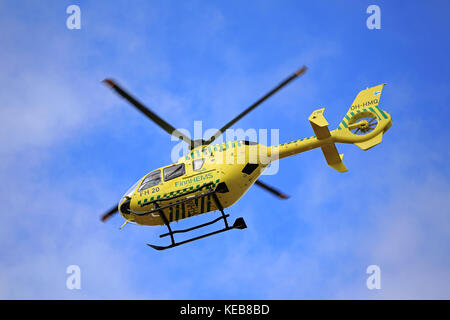 SALO, FINLAND - MARCH 27, 2016: FinnHEMS medical helicopter in flight. FinnHEMS is an abbreviation for Finnish Helicopter Emergency Medical Services. Stock Photo