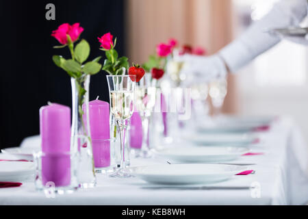 Close-up Of Champagne Glass On Decorated Wedding Table Stock Photo
