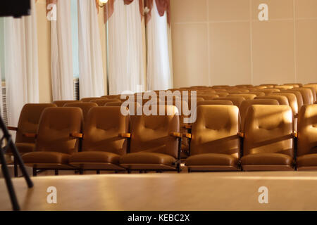 Empty comfortable brown seats in a hall Stock Photo