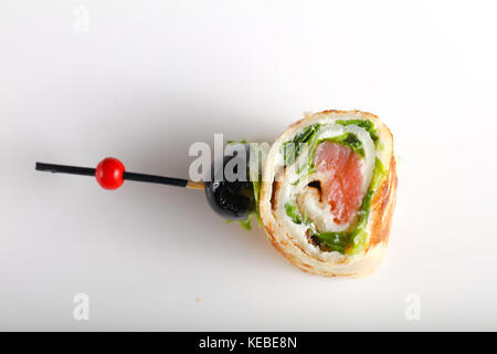 Pancake with salmon and salad leves roll Stock Photo