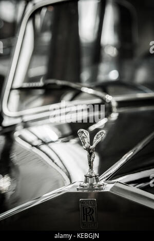 Black and white image of the Spirit of Ecstasy the iconic Flying Lady or Silver Lady on the bonnet of a Rolls Royce Silver Shadow classic car Stock Photo