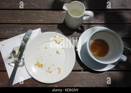 Plates with crumbs of food. Remains of food in plates after lunch 