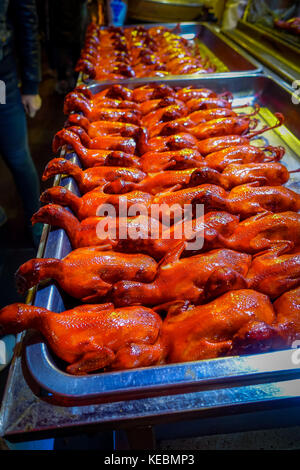 BEIJING, CHINA - 29 JANUARY, 2017: Rows of cooked ducks ready to eat, local chinese food market concept Stock Photo
