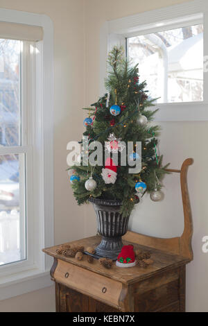 Christmas decorations on small tree Stock Photo