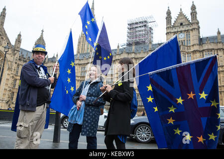 London, UK. 19th Oct, 2017. Anti-Brexit protesters stand with EU flags opposite the Palace of Westminster. Credit: Mark Kerrison/Alamy Live News Stock Photo