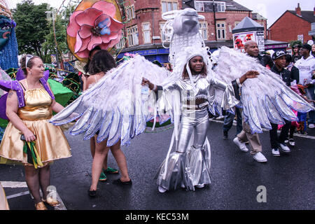 Leeds, Leeds, UK. 27th Aug, 2012. A participant seen dressed up with an outfit with wings.The Leeds West Indian Carnival is one of Europe's longest running authentic Caribbean Carnival parade in the UK. It started in 1967 as a way of keeping the Caribbean culture and tradition alive for those of West Indian descent in Leeds. Tens of thousands of revelers indulged in the sights and sounds of this spectacular Carnival. 2017 marks the milestone 50th anniversary of the Leeds West Indian Carnival. The Leeds Carnival features all three essential elements of a Caribbean Carnival: co Stock Photo
