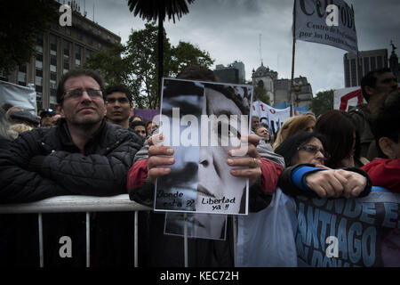 Federal Capital, Buenos Aires, Argentina. 16th Sep, 2017. A demonstrator is seen gathering to protest against the disappearance of Santiago Maldonado since 1 August 2017 while holding a photo of him.Despite the rain, thousands of protesters gathered on Sunday in Plaza de Mayo hosted by the relatives and friends of Santiago Maldonado two months after his disappearance, after he was reportedly surrendering to Argentinian police guards during a raid on a camp of Mapuche protesters in Patagonia, south of Argentina. Various protests were seen in several other cities in Argentina, and abroad Stock Photo