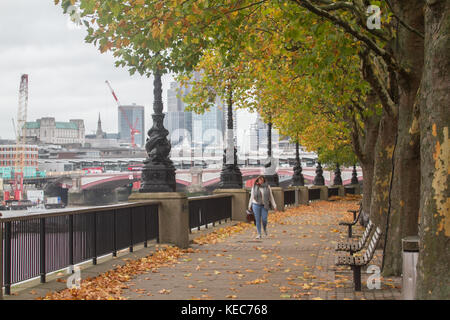 London, UK. 20th Oct, 2017. A woman strolls  on London South bank on a grey autumn day Credit: amer ghazzal/Alamy Live News