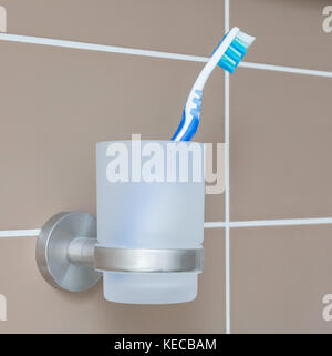 Toothbrush in a bathroom - Selective focus on the toothbrush Stock Photo