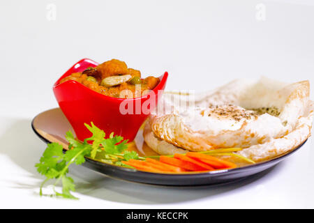 rice made Pappam with chicken/ mutton / prawns / fish curry and green leaf Stock Photo