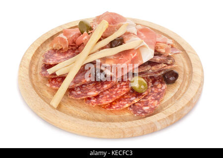Dry-cured pork slices on wooden plate isolated Stock Photo