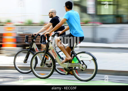 Montreal,Canada,23 September,2017. Bicycle riders out and about on BIXI bicycles in Montreal's downtown core. Credit:Mario Beauregard/Alamy Live News Stock Photo