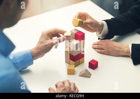 business cooperation and partnership concept - businessmen working together Stock Photo