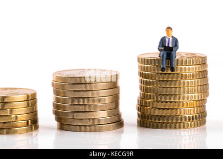 business growth concept - businessman sitting on his profit Stock Photo