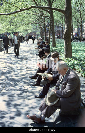 Group of Men Sitting on Park Benches, Bryant Park, New York City, New York, USA, July 1961 Stock Photo