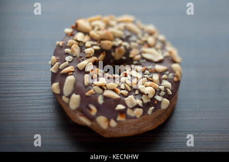 Donut with peanut closeup low focus Stock Photo