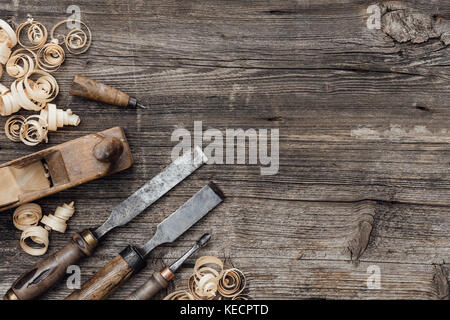 Old used woodworking tools on a vintage workbench: carpentry, craftsmanship and handwork concept Stock Photo