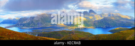 Sunny summer panorama of lofoten islands. Gorgeous noway landscape with blue fjords and green mountains. Stock Photo