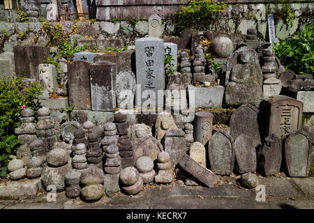 Kyoto, Japan - May 19, 2017: Old graves and headstones of the deceased at a Buddhist cemetery behind Chion-In temple in ancient Kyoto, Japan Stock Photo