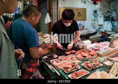 Kyoto, Japan -  May 22, 2017: Preparing and selling fresh raw fish at the Nishiki market, Kyoto's Kitchen in kyoto Stock Photo