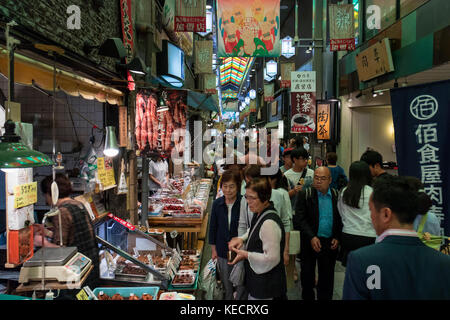 Kyoto, Japan -  May 22, 2017:  Shopping at the Nishiki market, Kyoto,called Kyoto's Kitchen, for fresh and prepared fish Stock Photo