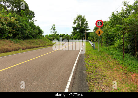 Road Signs Show Maximum Speed 20 KM/H and Double Bends Stock Photo - Alamy