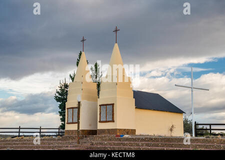 Heavy clouds over roadside church near Lago Buenos Aires aka Lago General Carrera near town of Los Antiguos, Patagonia, Argentina Stock Photo