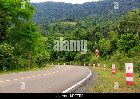 Road Signs Show Maximum Speed 20 KM/H and Double Bends. Stock Photo
