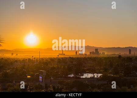 Las Vegas, Nevada, USA - October 10, 2017:  Orange sunrise view of towers on the Las Vegas strip. Stock Photo