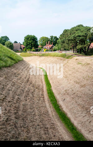 Earthwork and ditch around Inner Bailey of 12th century Norman castle at Castle Rising in West Norfolk Stock Photo