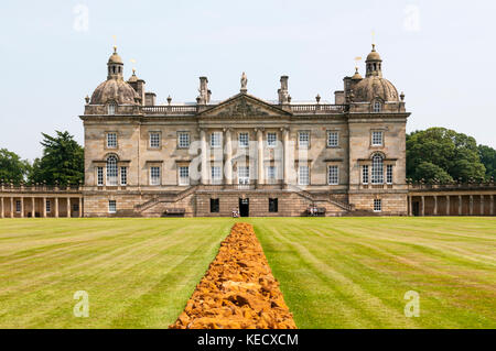 Houghton Hall in West Norfolk, built for Robert Walpole in 1722-1735.  A Line in Norfolk by Richard Long in foreground. Stock Photo