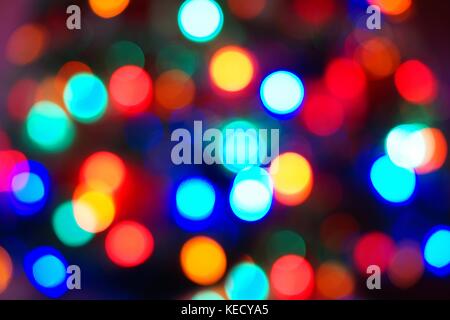 Defocused multi color Christmas light background Stock Photo