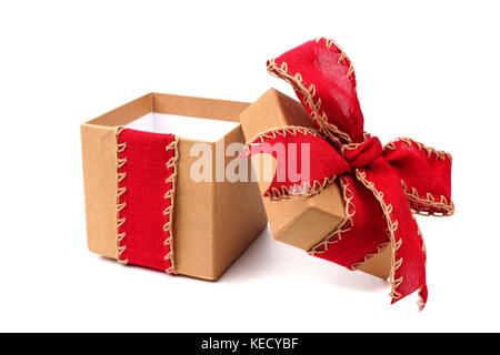 Opened brown gift box wrapped with rustic red bow and ribbon isolated on white Stock Photo
