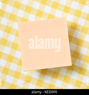 Reminder sticky notes on yellow check pattern fabric background Stock Photo