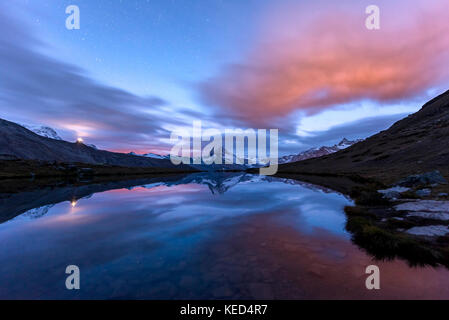 Night view, starry sky, snow-covered Matterhorn reflected in the Sellisee, Valais, Switzerland Stock Photo