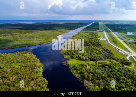 Florida,FL South,Lakeport,highway Highway Route 78,water,canal,Lake Okeechobee,aerial overhead bird's eye view above,visitors travel traveling tour to Stock Photo