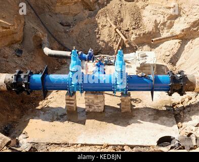 500 mm drink water Gate valve joint with screwed pipe fitting - repairing of main water pipeline underground Stock Photo