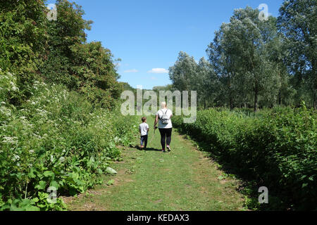 Woman and young boy in Whetmead Nature Reserve, Witham, Essex, UK Stock Photo