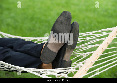 Close-up Of A Man Relaxing In Hammock Stock Photo