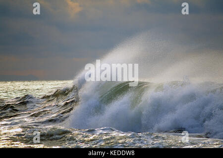 Scenic. Stormy sky over the Atlantic ocean with large wave breaking. Stock Photo