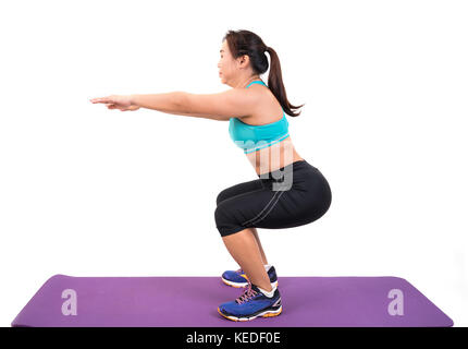 chubby woman doing fitness on white background Stock Photo