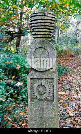 A carved wooden waymark post in woodlands at Pretty Corner, Upper Sheringham, Norfolk, England, United Kingdom. Stock Photo