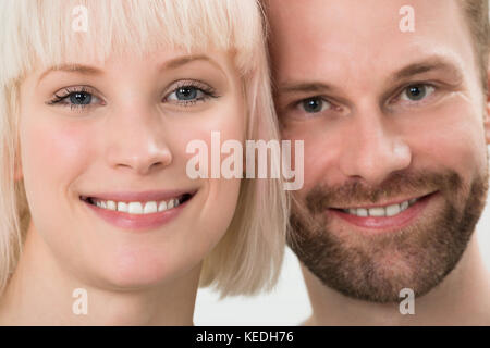 Close-up Photo Of Toothy Smiling Young Couple Stock Photo