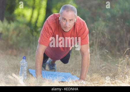 man doing push ups Stock Photo