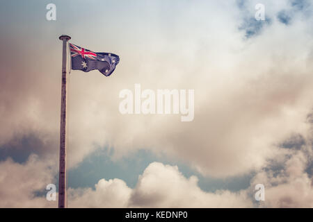 Australian flag on a flag pole with beautiful sky as background and copy space Stock Photo