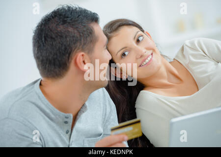couple at home buying on internet Stock Photo