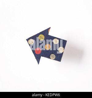 Arrow shaped paper on white background Stock Photo
