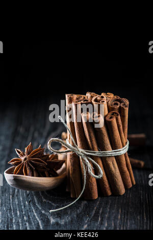Cinnamon sticks and star anise on a dark background Stock Photo