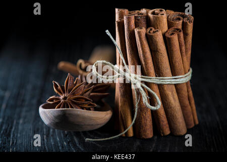 Cinnamon sticks and star anise on a dark background Stock Photo