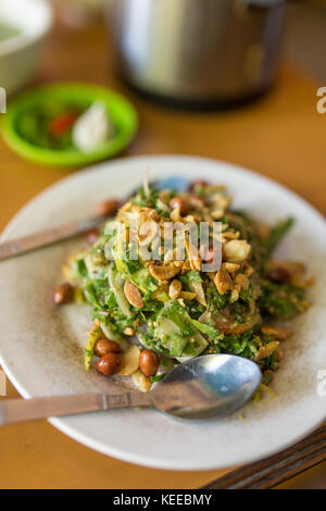 Traditional burmese tea leaf salad with fermented green tea leaves in Myanmar Stock Photo